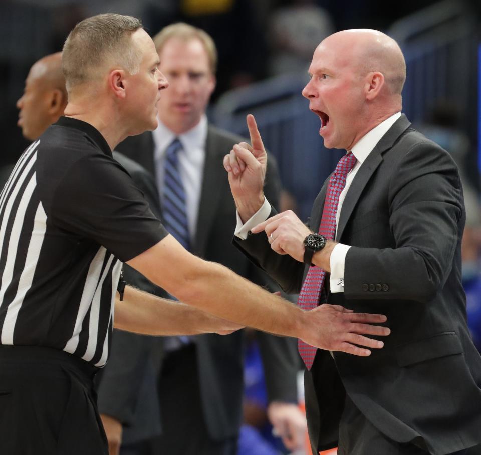 Seton Hall head coach Kevin Willard yells at referee Paul Szelc after Marquette guard Greg Elliott was fouled by guard Bryce Aiken with 1.7 seconds left.