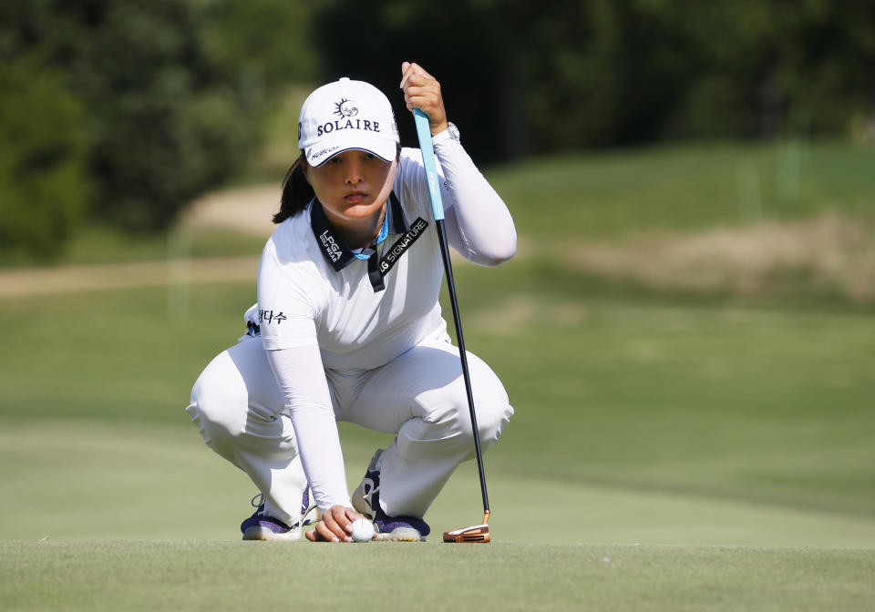 Jin Young Ko, of South Korea, lines up her putt on the 12th green during the final round of the LPGA Volunteers of America Classic golf tournament in The Colony, Texas, Sunday, July 4, 2021. (AP Photo/Ray Carlin)