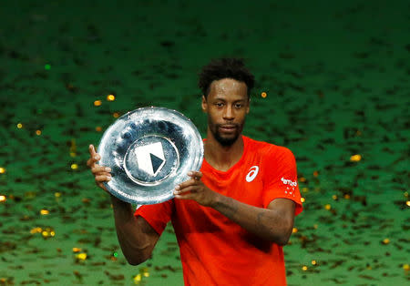 Tennis - ATP 500 - Rotterdam Open - Rotterdam Ahoy, Rotterdam, Netherlands - February 17, 2019 France's Gael Monfils celebrates winning the Rotterdam Open with the trophy REUTERS/Eva Plevier