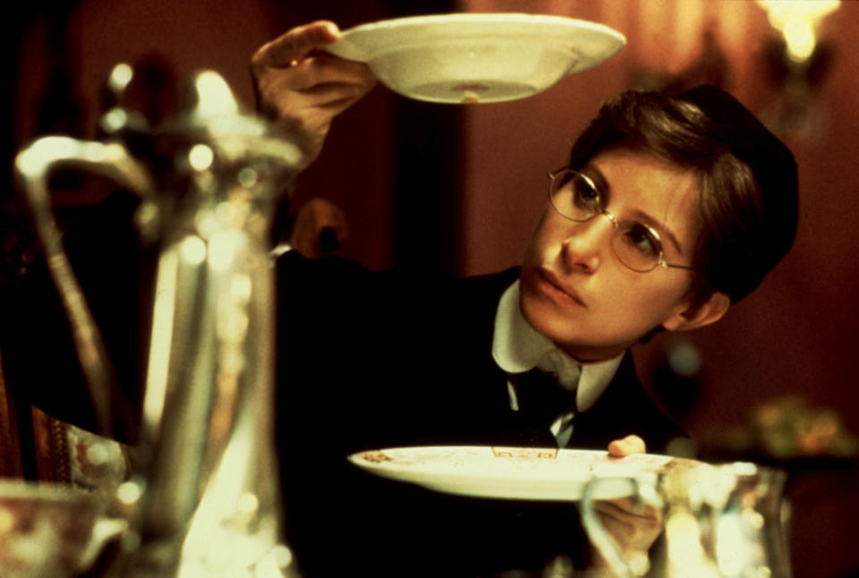 Barbra Streisand holding a dish in "Yentl"