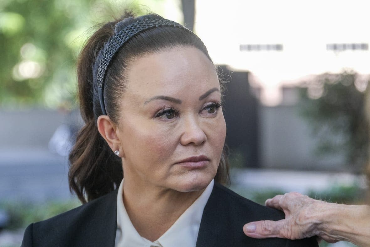 Alana Gee, the widow of a former University of Southern California football player suing the NCAA for failing to protect her husband from repetitive head trauma, leaves the Stanley Mosk civil courthouse of Los Angeles Superior Court on Oct. 21, 2022. (AP Photo/Ringo H.W. Chiu, File)