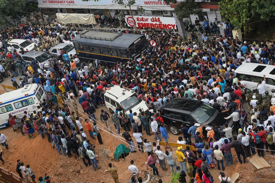 Public and fans of Kannada cinema actor Puneeth Rajkumar anxiously wait outside a private Hospital after the news of his critical health condition in Bangalore on October 29, 2021. (Photo by Manjunath Kiran / AFP) (Photo by MANJUNATH KIRAN/AFP via Getty Images)