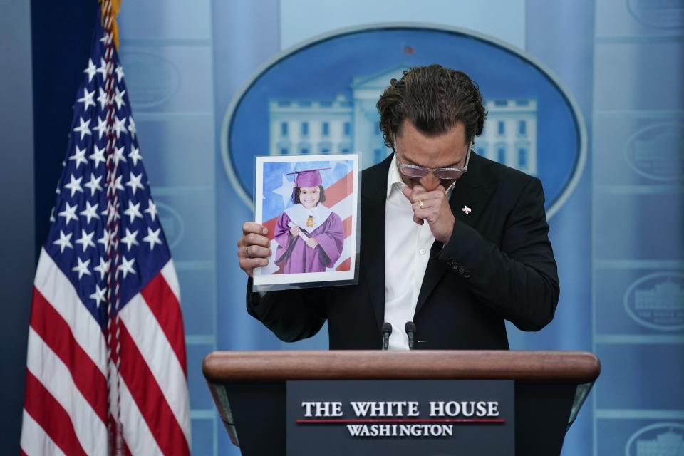 At a White House news conference last year, Matthew McConaughey, a Uvalde native, holds an image of Alithia Ramirez, 10, who was killed in the Uvalde school mass shooting.