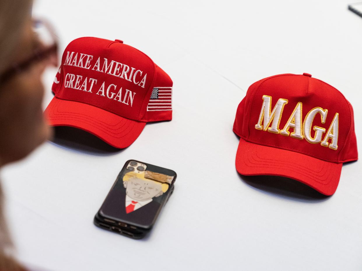 Make America Great Again hats are seen during the America First Policy Institute's America First Agenda Summit at the Marriott Marquis on Tuesday, July 26, 2022.