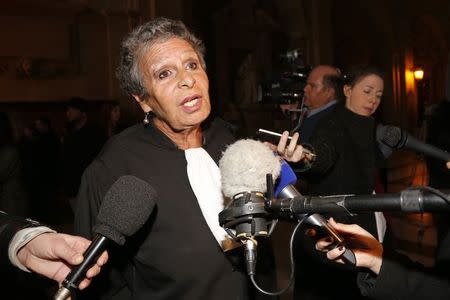 Francoise Cotta, lawyer of the driver Eric Robic, speaks to journalists as she arrives for the start of the trial of Robic and Meliodon at the Paris courthouse November 27, 2014. REUTERS/Jacky Naegelen