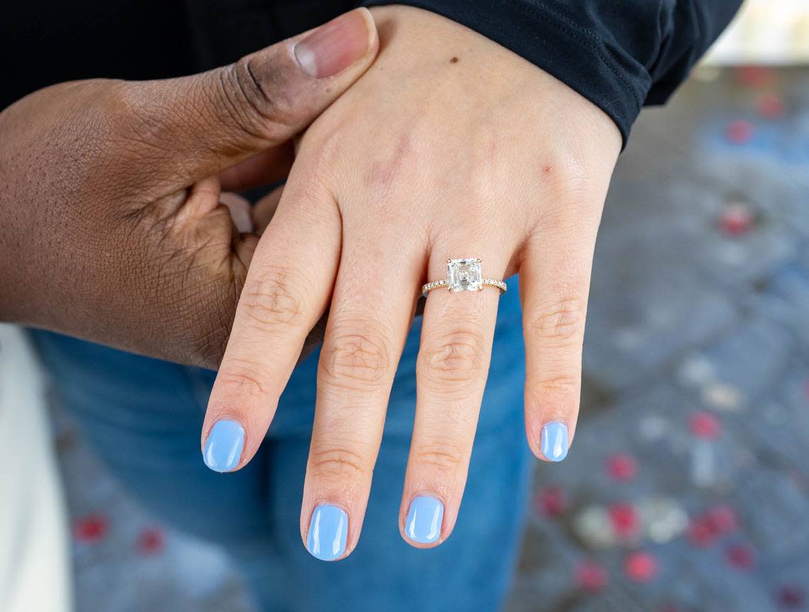 Shelby Ray, 31, shows off her engagement ring at Capitol Park’s World Peace Rose Garden on Sunday, March 3, 2024. Cameron Clark/cclark@sacbee.com