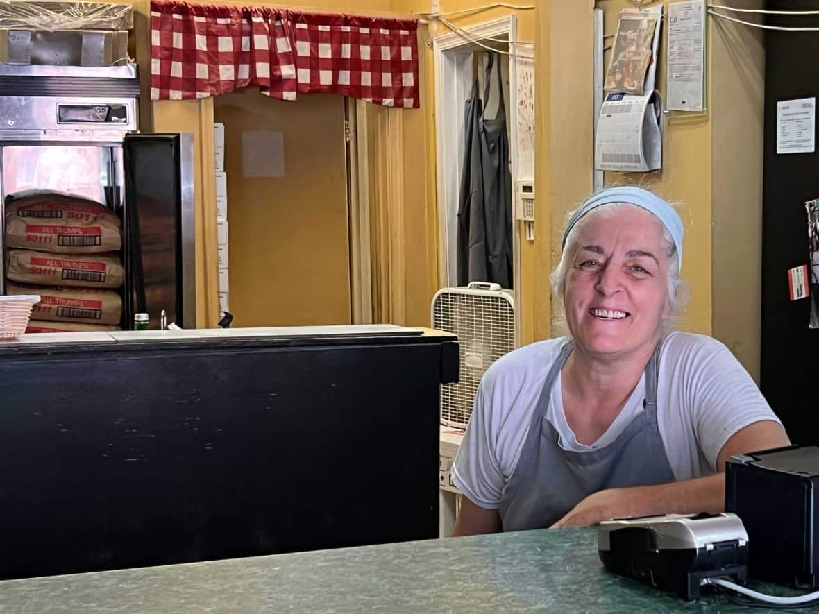 Fatma Nayir, 61, owns Mama's Pizza Kitchen in the Anacostia neighbourhood in Washington, D.C. She says almost everything she needs to run her business has gone up in price over the last year as inflation hit 9.1 per cent overall. (Kazi Stastna/CBC - image credit)