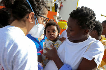 Migrants disembark from the MV Aquarius rescue ship, after being rescued by SOS Mediterranee organisation, in the Sicilian harbour of Trapani, Italy, September 16, 2017. REUTERS/Tony Gentile