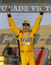 Kyle Busch celebrates after winning a NASCAR Cup Series auto race on Sunday, Nov. 11, 2018, in Avondale, Ariz. (AP Photo/Rick Scuteri)