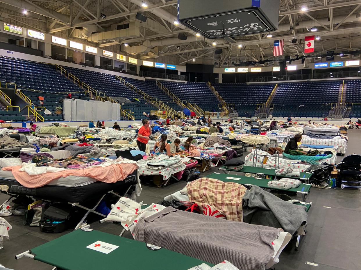 Hundreds of people using the Hertz Arena in Estero, Fla., as shelter are sleeping in the Florida Everblades hockey rink on Thursday, Oct. 13, 2022.