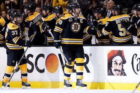 Apr 26, 2014; Boston, MA, USA; Boston Bruins defenseman Zdeno Chara (33) celebrates with teammates after scoring goal during the second period against the Detroit Red Wings in game five of the first round of the 2014 Stanley Cup Playoffs at TD Banknorth Garden. Mandatory Credit: Greg M. Cooper-USA TODAY Sports