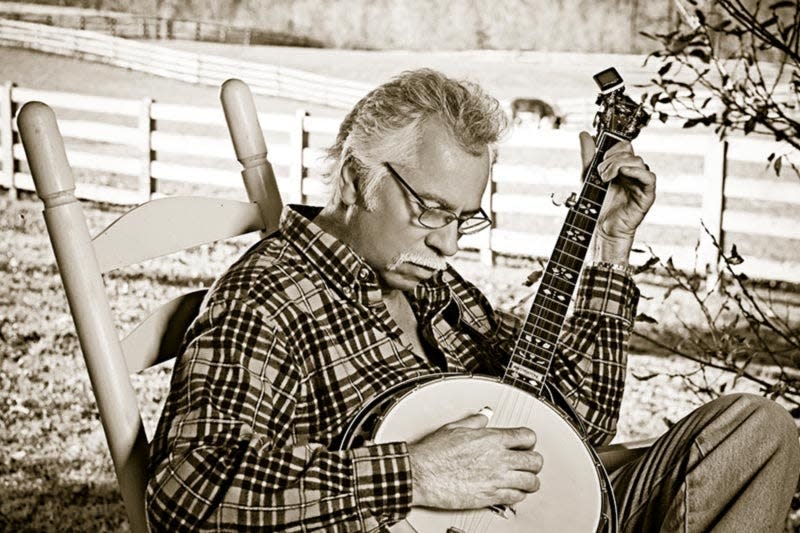 Oak Ridge Boys member Joe Bonsall playing the banjo.