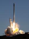 A Falcon 9 rocket carrying a small science satellite for Canada is seen as it is launched from a newly refurbished launch pad in Vandenberg Air Force Station September 29, 2013. The unmanned rocket blasted off from California on Sunday to test upgrades needed for planned commercial launch services. The 22-story rocket, built and flown by Space Exploration Technologies, or SpaceX, soared off a newly refurbished, leased launch pad at Vandenberg Air Force Station at noon EDT/1600 GMT (05.00 p.m. British time). REUTERS/Gene Blevins (UNITED STATES - Tags: SCIENCE TECHNOLOGY)