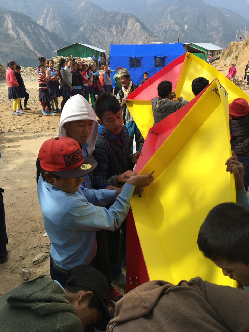 Schoolkids construct the dome by themselves at Sindupalchok, Nepal. <cite>The Mars Society</cite>