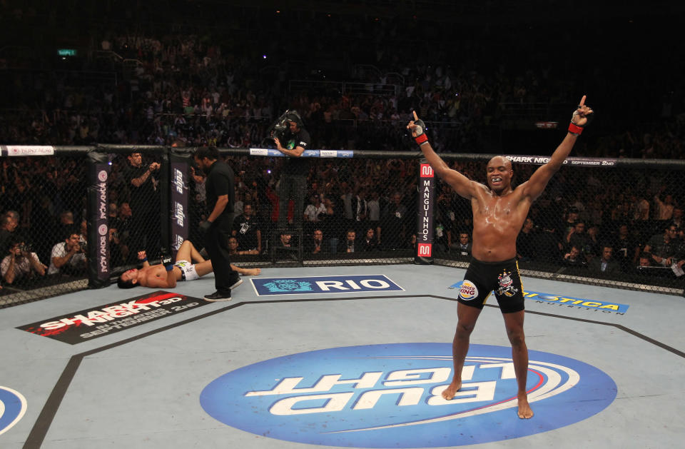 Anderson Silva (R) celebrates after knocking out Yushin Okami (L) in the UFC Middleweight Championship bout at UFC 134 at HSBC Arena on August 27, 2011 in Rio de Janeiro, Brazil. (Photo by Al Bello/Zuffa LLC/[Zuffa LLC via Getty Images)