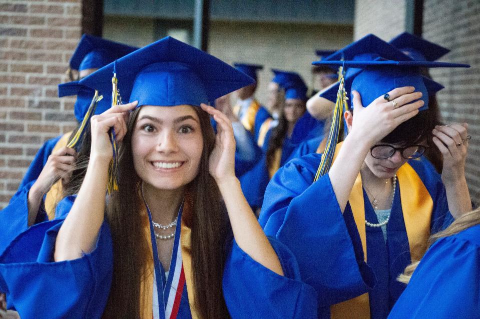 Merrol Hyde Magnet School graduates smile during a commencement ceremony on May 21, 2022.