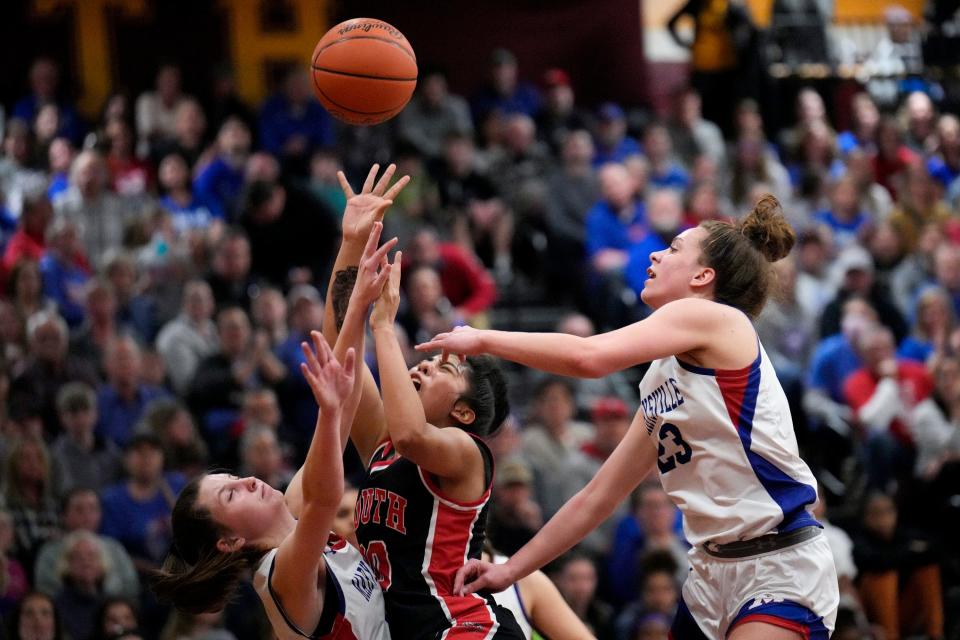 Westerville South's Tamara Ortiz, center, battles for the ball with Marysville's Ava Wilkerson (4) and Addy Tweed.