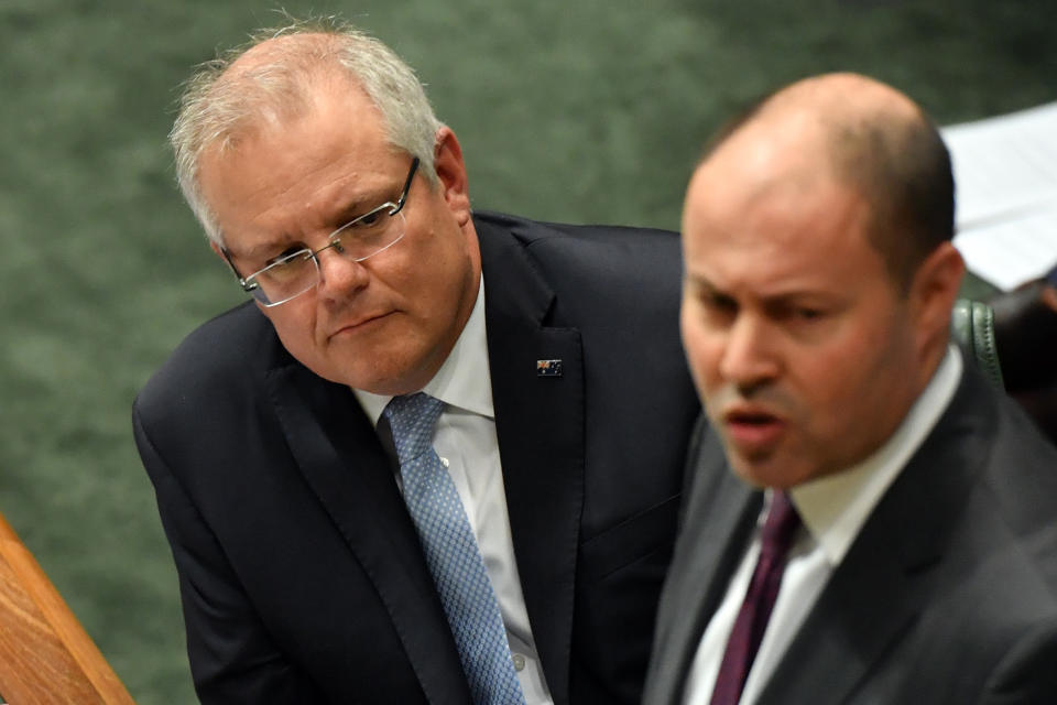 CANBERRA, AUSTRALIA - JUNE 12: Prime Minister Scott Morrison listens as Treasurer Josh Frydenberg speaks at the despatch box during Question Time in the House of Representatives at Parliament House on June 12, 2020 in Canberra, Australia. The government last month promised to repay $720m to 373,000 past and present welfare recipients over 470,000 unlawful demands for money calculated using faulty “income averaged” annual pay data as part of Centrelink’s income compliance program. New polling has showed significant support for a royal commission into the debacle, and revelations that internal estimates have shown the total value of those 470,000 unlawful debts will be close to $1.5bn AUD.  (Photo by Sam Mooy/Getty Images)