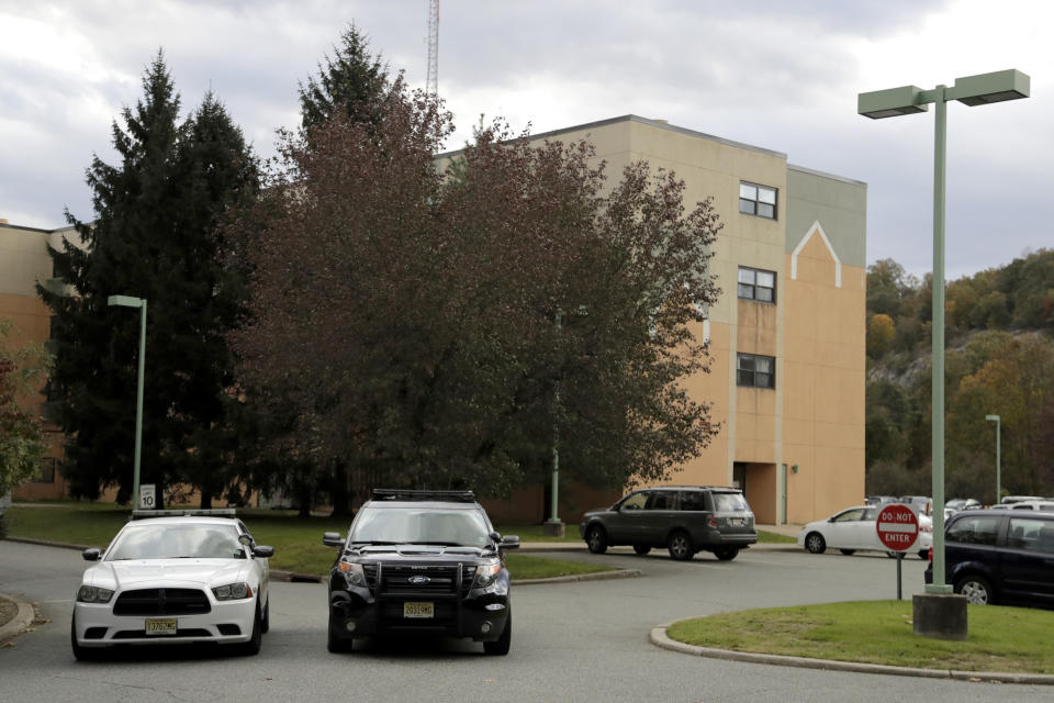 Police cruisers are seen parked near the entrance of the Wanaque Center for Nursing and Rehabilitation in Haskell, New Jersey. (Photo: THE ASSOCIATED PRESS)