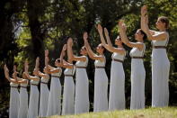 Priestesses dance inside the ancient Olympic Stadium during the dress rehearsal for the Olympic flame lighting ceremony for the Rio 2016 Olympic Games at the site of ancient Olympia in Greece. REUTERS/Yannis Behrakis