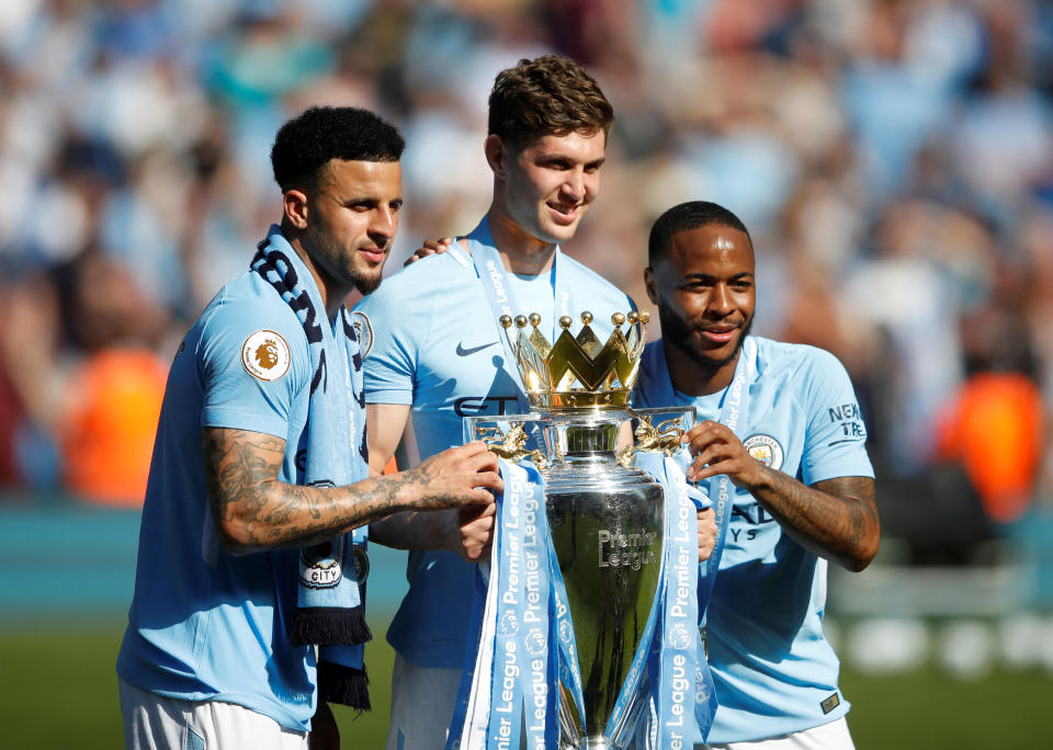 <p>Soccer Football – Premier League – Manchester City vs Huddersfield Town – Etihad Stadium, Manchester, Britain – May 6, 2018 Manchester City’s John Stones, Kyle Walker and Raheem Sterling pose as they celebrate with the trophy after winning the Premier League title Action Images via Reuters/Carl Recine EDITORIAL USE ONLY. No use with unauthorized audio, video, data, fixture lists, club/league logos or “live” services. Online in-match use limited to 75 images, no video emulation. No use in betting, games or single club/league/player publications. Please contact your account representative for further details. </p>