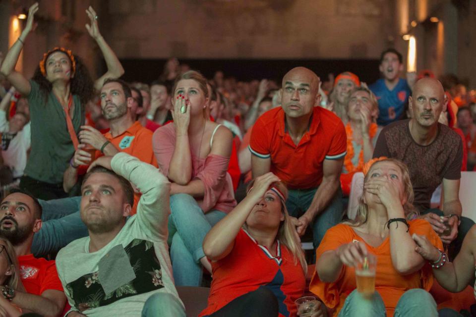 Dutch fans react as they watch Netherlands' 2014 World Cup semi-final soccer match against Argentina, at a public screening in Amsterdam July 9, 2014.REUTERS/Cris Toala Olivares