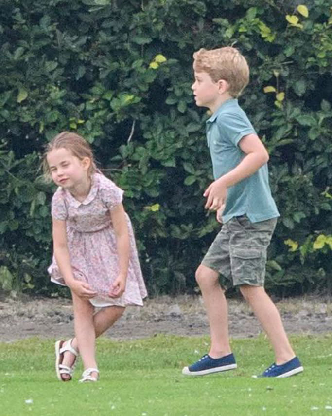 Prince George in Trotters Hampton canvas Plum shoes and Princess Charlotte in John Lewis & Partners Isla sandals. - Credit: Tim Rooke/Shutterstock