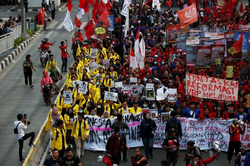 University students and members of Indonesian labour organisations take part in a protest over human rights, corruption and social and environmental issues in Jakarta, Indonesia