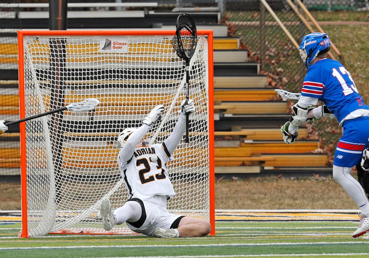 Adrian College's Sam Spangler makes a stop during Saturday's game against Hanover. [Telegram photo by John Discher]