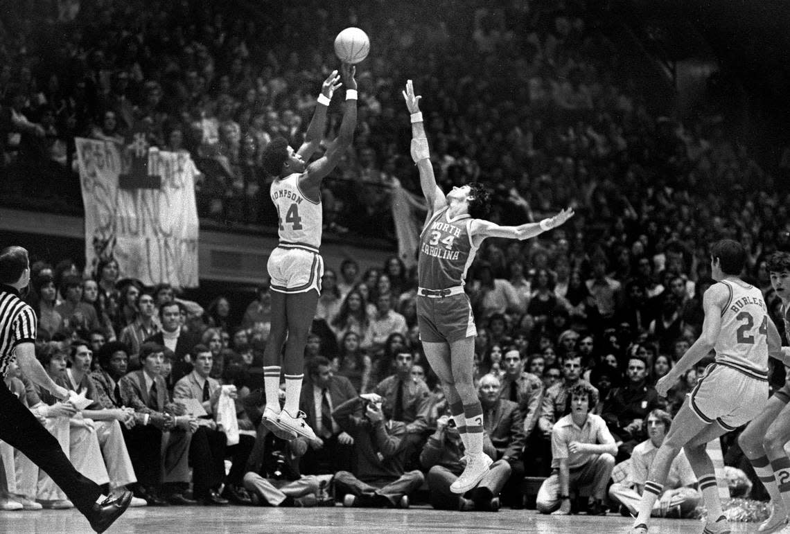 NC State’s David Thompson shoots over UNC’s Bobby Jones in action in Reynolds Coliseum in Raleigh, NC Feb. 26, 1974.