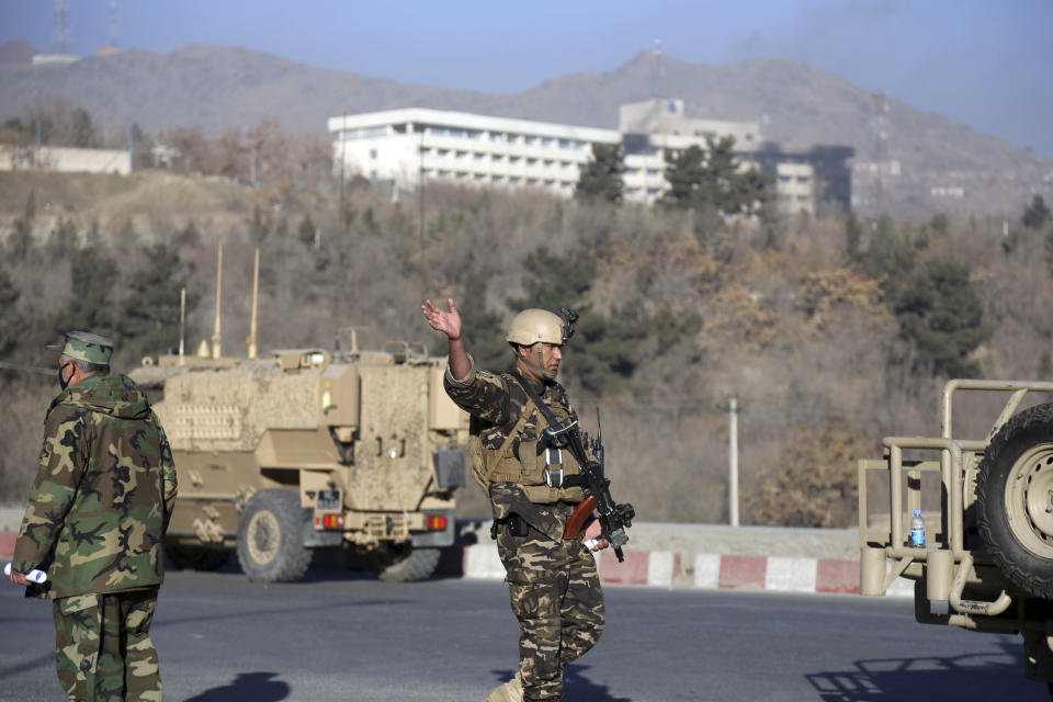 <p>An Afghan security personnel stand guard near the Intercontinental Hotel after an attack in Kabul, Afghanistan, Jan. 21, 2018. (Photo: Rahmat Gul/AP) </p>