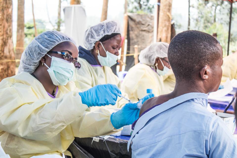 BUTEMBO, CONGO - JULY 27: A healthcare member inoculates a man for Ebola suspicion to take precautions against the disease in Butembo, Democratic Republic of the Congo on July 27, 2019. (Photo by JC Wenga/Anadolu Agency via Getty Images)