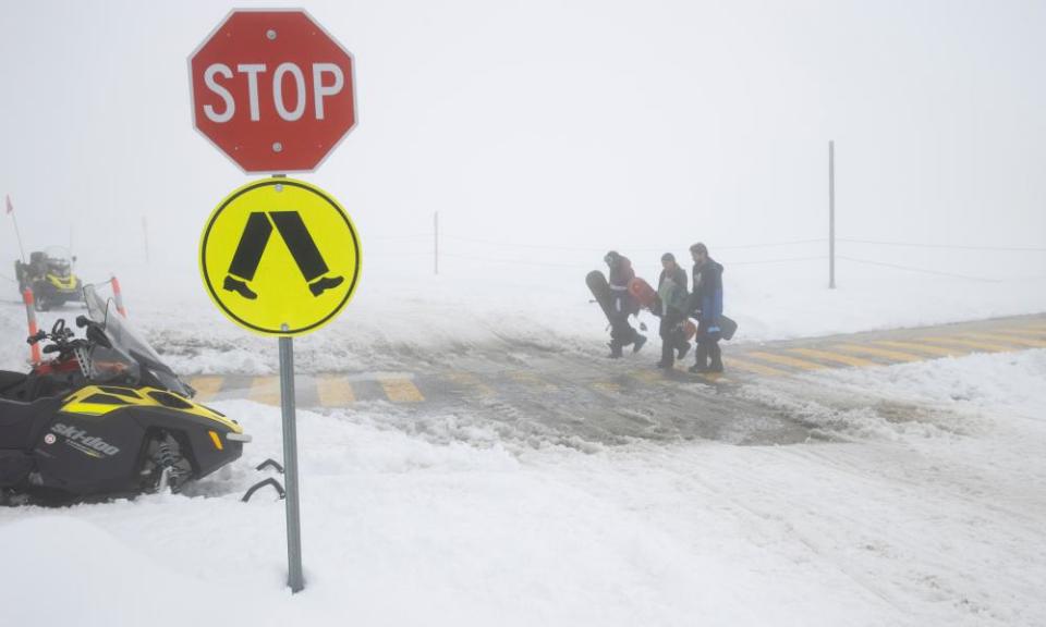 Snowboarders return to the ski tube after fresh snowfalls and a complete white out at Persher ski fields