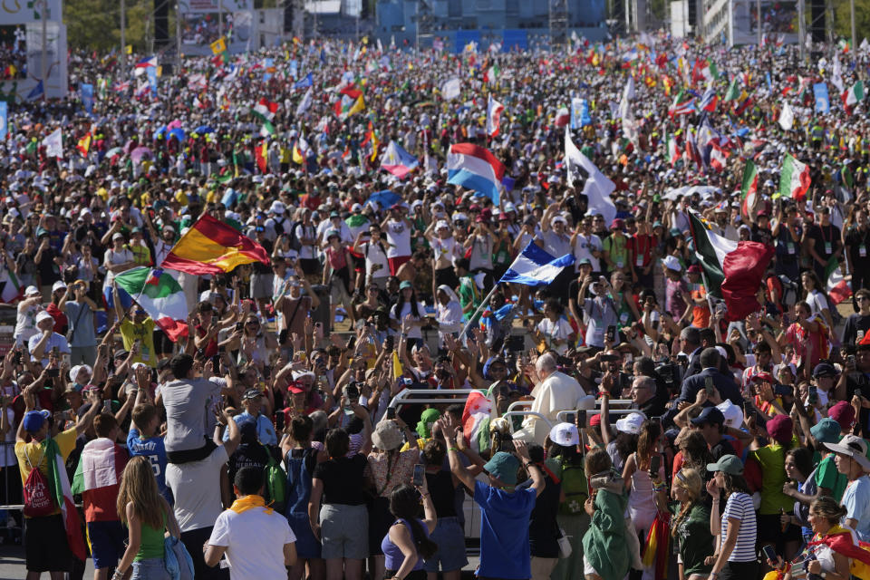 Pope Francis arrives at Lisbon's Parque Eduardo VII to preside over a 'Via Crucis' (Way of the Cross) with young people participating into Sunday's 37th World Youth Day in the Portuguese capital, Friday, Aug. 4, 2023. Francis is in Portugal through the weekend to preside over the jamboree that St. John Paul II launched in the 1980s to encourage young Catholics in their faith. (AP Photo/Armando Franca)