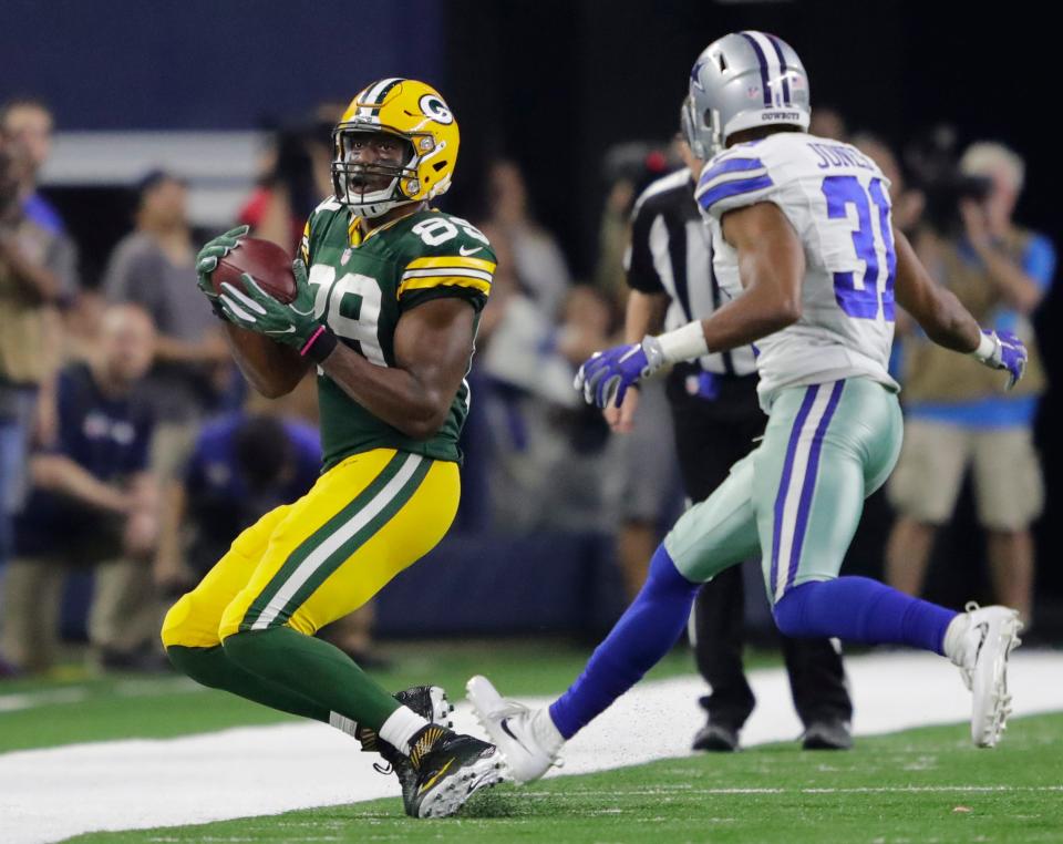 Green Bay Packers tight end Jared Cook pulls down a first-down reception against the Dallas Cowboys' Byron Jones at the end of the fourth quarter to set up the game-winning field goal as the Packers won the NFC divisional playoff game 34-31 Sunday, Jan. 15, 2017, at AT&T Stadium in Arlington, Texas.