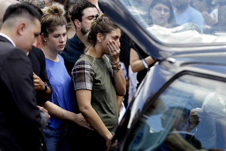 Romina Sala, the sister Argentine soccer player Emiliano Sala, cries at the end of her brother's wake in Progreso, Argentina, Saturday, Feb. 16, 2019. The Argentina-born forward died in an airplane crash in the English Channel last month when flying from Nantes in France to start his new career with English Premier League club Cardiff. (AP Photo/Natacha Pisarenko)