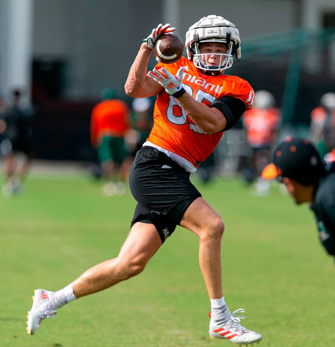 Miami Hurricanes tight end Will Mallory (85) catches the ball while running drills with his team at the University of Miami’s Greentree Practice Fields on Monday, Aug. 8, 2022, in Coral Gables, Fla.