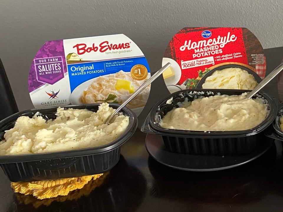 four brands of premade mashed potatoes lined up in a row