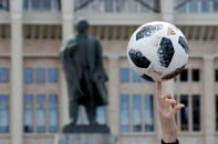 Soccer Football - World Cup - Group A - Russia vs Saudi Arabia - Luzhniki Stadium, Moscow, Russia - June 14, 2018 General view of a statue of Vladimir Lenin and a ball outside the stadium before the match REUTERS/Christian Hartmann