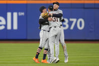 Detroit Tigers' Kerry Carpenter, left, Parker Meadows, right, and Riley Greene (31) celebrate after a baseball game against the New York Mets Monday, April 1, 2024, in New York. The Tigers won 5-0. (AP Photo/Frank Franklin II)