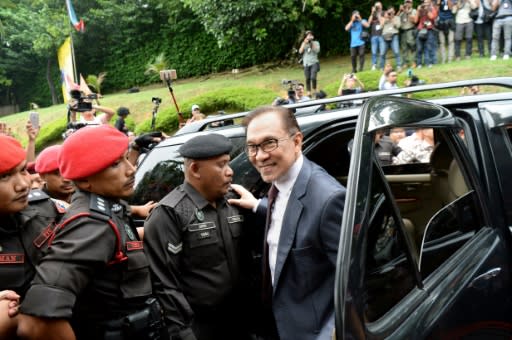 Anwar arrives at his house following his release