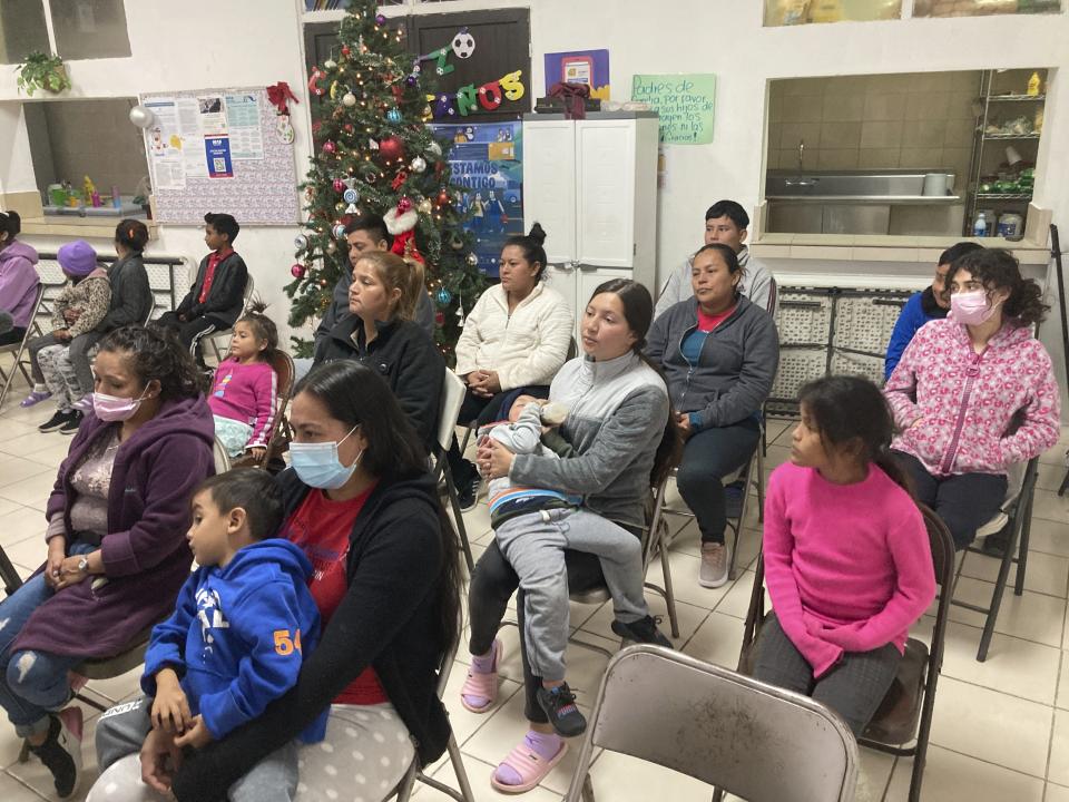 Guests at the Buen Samaritano shelter for migrants attend a candle lighting ceremony at the shelter's small Methodist church in anticipation of Christmas in Ciudad Juárez, Mexico, across from El Paso, Texas, on Thursday, Dec. 22, 2022. Tens of thousands of migrants who fled violence and poverty will spend Christmas in crowded shelters or on the dangerous streets of Mexican border towns. The Biden administration asked the Supreme Court not to lift pandemic-era restrictions on asylum-seekers before the holiday weekend.(AP Photo/Morgan Lee)