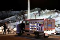 Rescue workers search on a collapsed building after an earthquake in Elazig