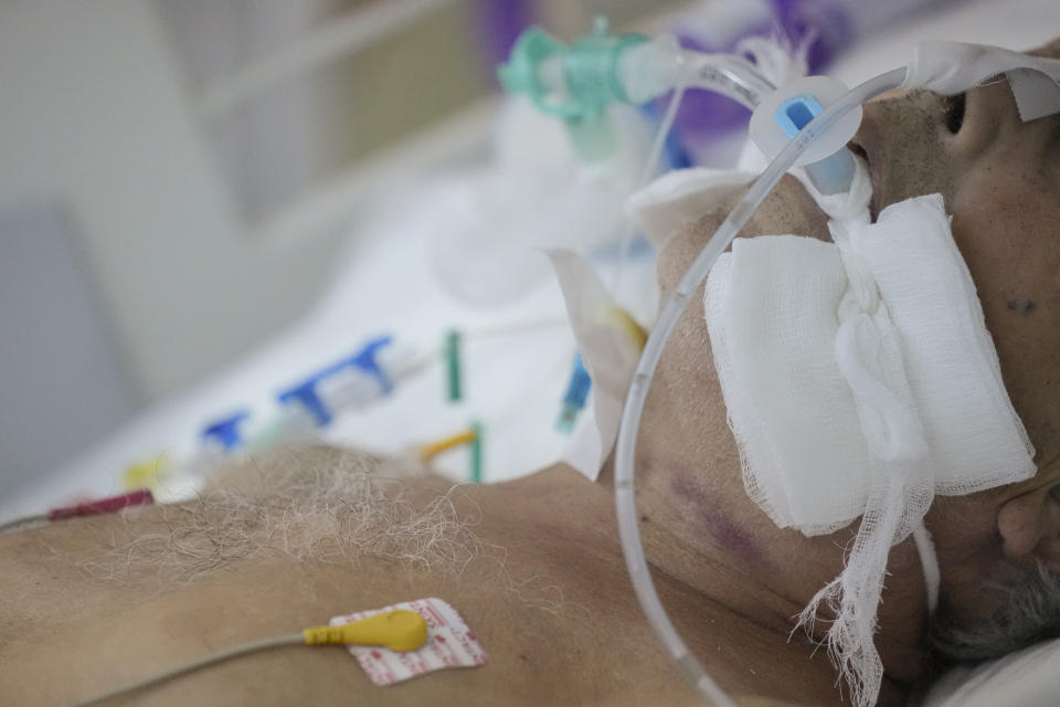 A man is incubated at the COVID-19 ICU unit of the Marius Nasta National Pneumology Institute in Bucharest, Romania, Thursday, Sept. 23, 2021. Daily new coronavirus infections in Romania, a country of 19 million, have grown exponentially over the last month, while vaccine uptake has declined to worrying lows. Government data shows that 91.5% of COVID-19 deaths in Romania between Sept. 18-23 were people who had not been vaccinated. (AP Photo/Vadim Ghirda)