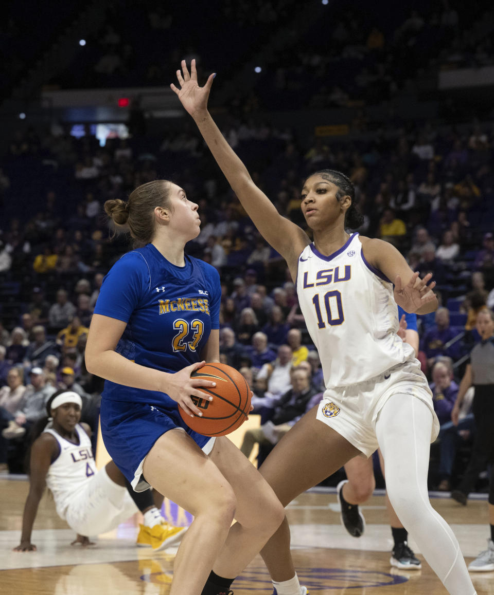 LSU forward Angel Reese (10) defends against McNeese guard Emilia Tenbrock (23), during an NCAA basketball, Tuesday, Dec. 12, 2023, in Baton Rouge, La. (Hilary Scheinuk/The Advocate via AP)