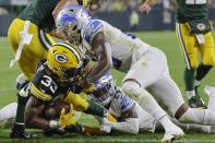 Green Bay Packers' Aaron Jones runs for a touchdown during the second half of an NFL football game against the Detroit Lions Monday, Sept. 20, 2021, in Green Bay, Wis. (AP Photo/Mike Roemer)