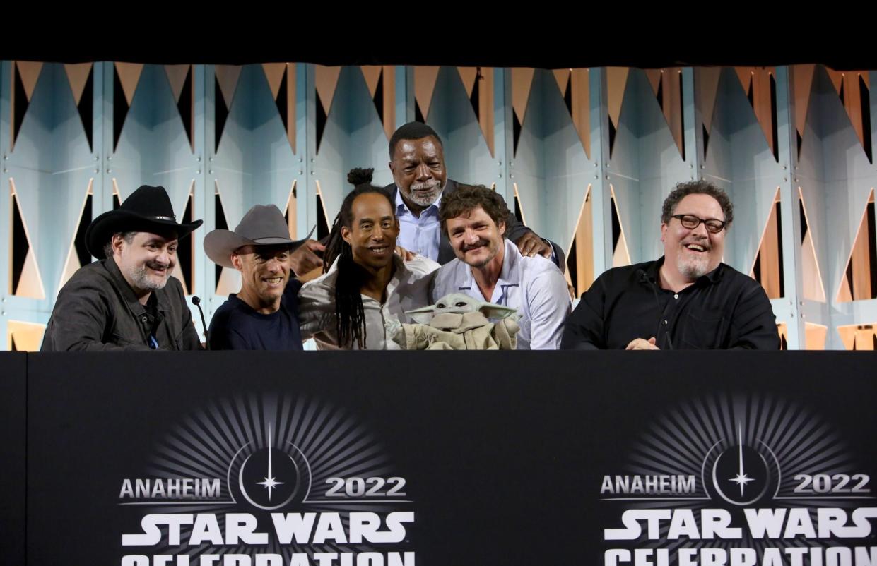 ANAHEIM, CALIFORNIA - MAY 28: (L-R) Dave Filoni, Brendan Wayne, Lateef Crowder, Carl Weathers, Pedro Pascal and Jon Favreau attend the panel for “The Mandalorian” series at Star Wars Celebration in Anaheim, California on May 28, 2022. (Photo by Jesse Grant/Getty Images for Disney)