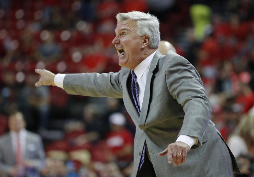 Kansas State head coach Bruce Weber motions to his players during overtime of an NCAA college basketball game against UNLV, Saturday, Nov. 9, 2019, in Las Vegas. (AP Photo/John Locher)