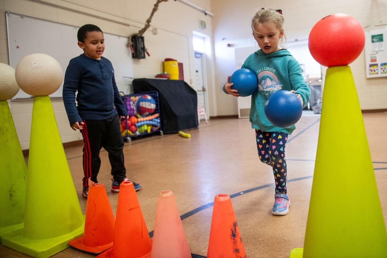 Preschool students play in the gym at Livermore Elementary School in Livermore on Dec. 4.