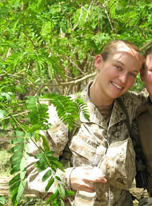 Claire Russo in a courtyard in Fallujah, Iraq, in 2006, when she served as the targeting officer for the 1st Marine Expeditionary Force. She deployed two weeks after testifying at the discharge hearing of the serviceman who raped her, Douglas Alan Dowson -- he was already in prison.